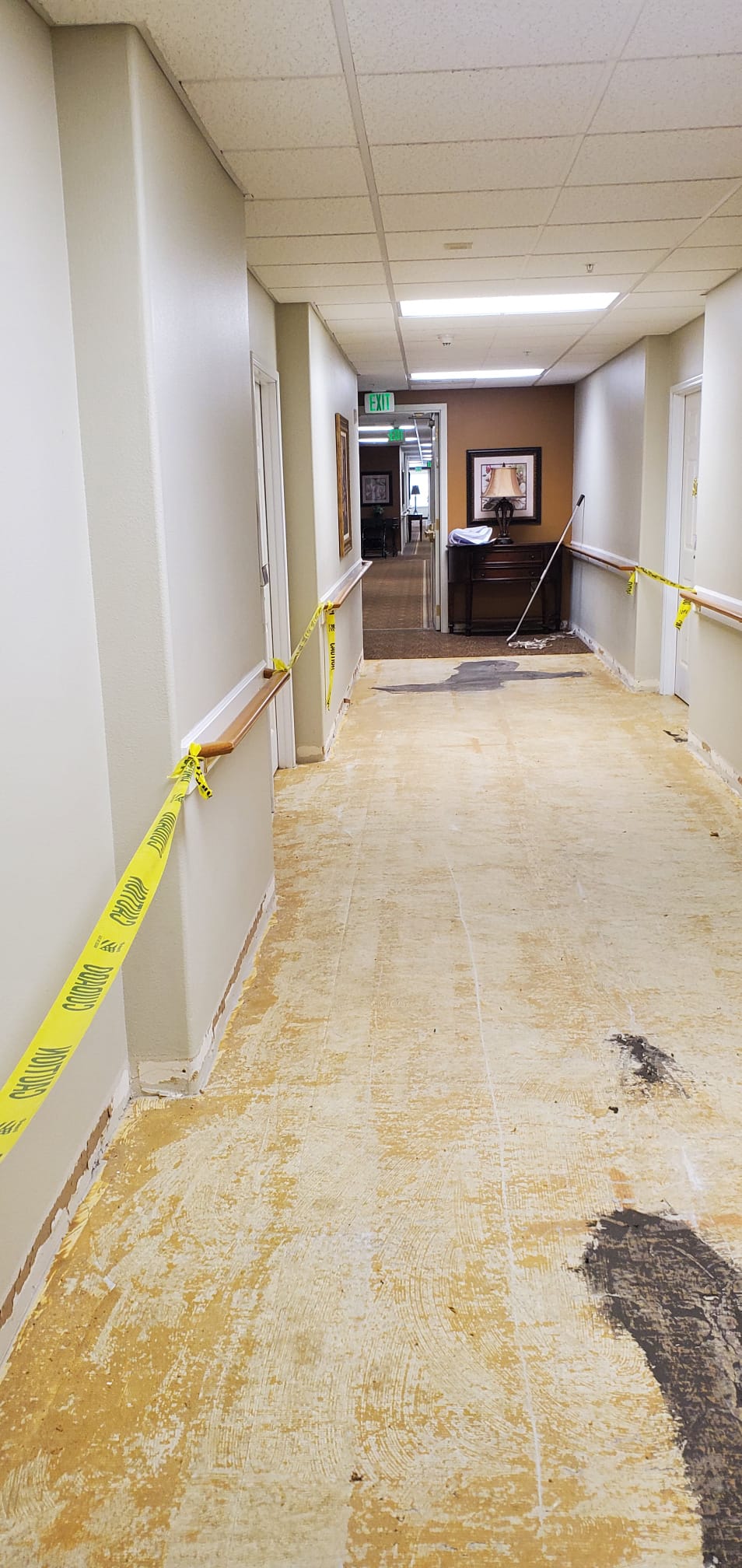Old flooring removed from a commercial hallway