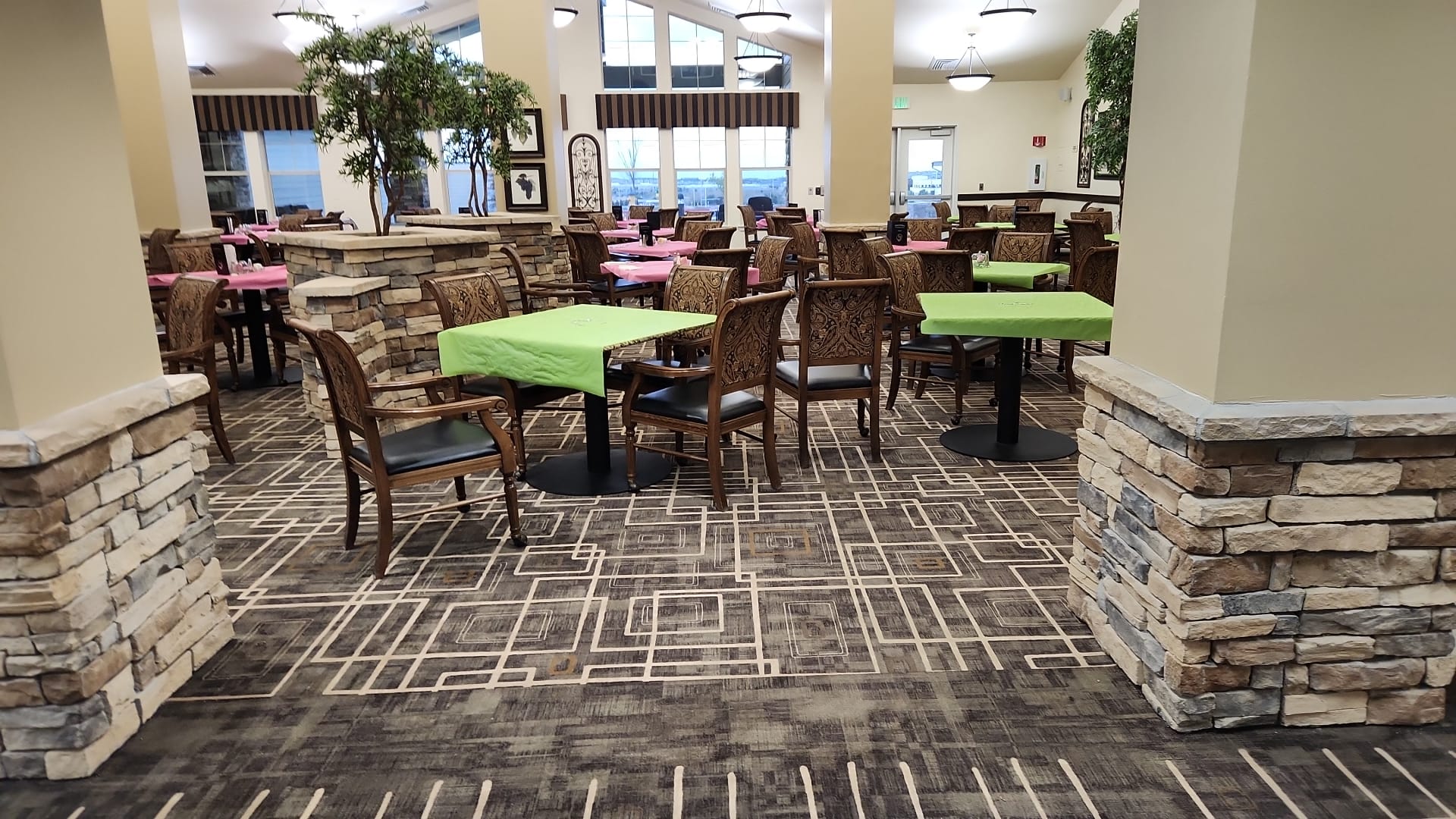 Geometric patterned carpet in a community dining room